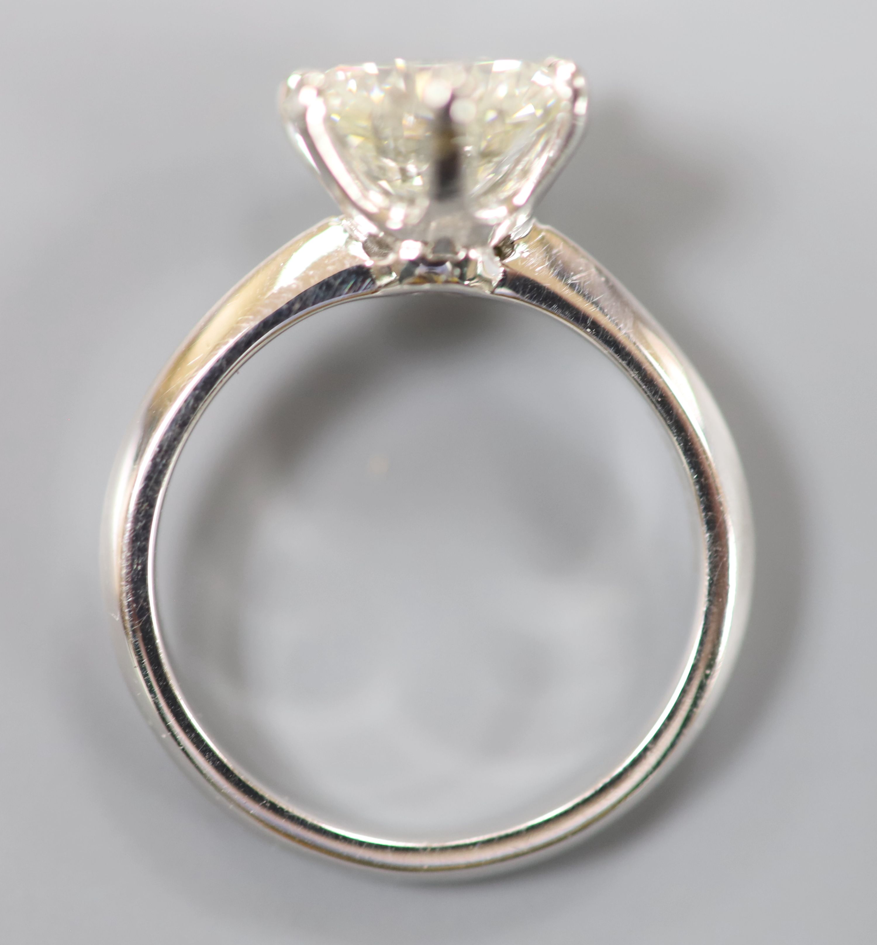 A modern platinum and solitaire diamond ring,